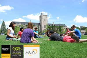 A group of people are sitting on a grassy field having a discussion in front of a university building, likely about LED Lighting Retrofits. Logos for the University of Guelph, The Green Gryphon Initiative, and MCW are shown at the bottom left.