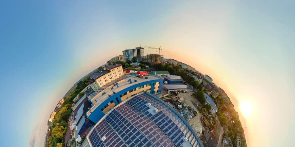 Little planet with big sustainable electric power plant with many rows of solar photovoltaic panels